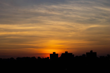 Fototapeta na wymiar Sunset cityscape nightfall skyline