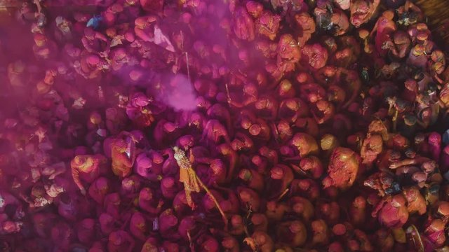 Color battle at the holi festival in India, 4k aerial shot