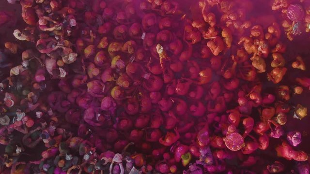 Color battle at the holi festival in India, 4k aerial shot