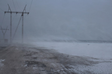 Electric high poor visibility on the road in the winter on the track snowstorm sweeps dangerous...