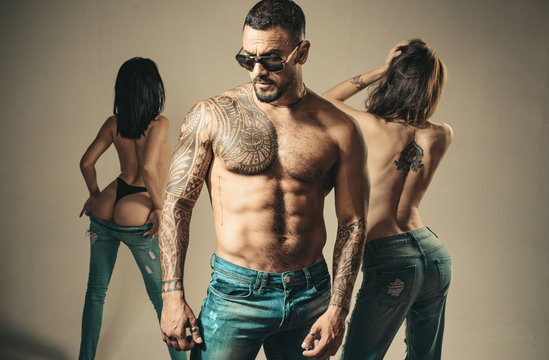 Seductive And Charming. Seductive Man Seducing Sensual Women. Sexy Hispanic Man With Seductive Look Through Glasses. Handsome Latino Man With Seductive Six Pack Ab Torso