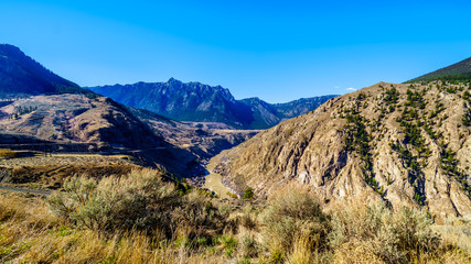 View of the Fraser River along Highway 99, from the area called the 10 mile slide or Fountain Slide, as the river flows to the town of Lillooet in the Chilcotin region on British Columbia, Canada
