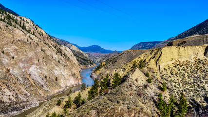 Fototapeta premium View of the Fraser River along Highway 99, from the area called the 10 mile slide or Fountain Slide, as the river flows to the town of Lillooet in the Chilcotin region on British Columbia, Canada