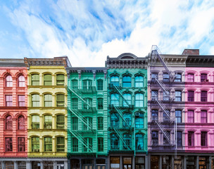 Rainbow colored block of old buildings in the SoHo neighborhood of Manhattan in New York City with...
