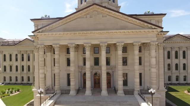 Flying up the north entrance to the capitol building in Topeka Ks on a sunny spring day. Awesome view of the front steps, columns, tower, copper dome, and Ad Astra statue.
