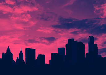 Downtown skyline buildings at sunset in Manhattan, New York City in pink and blue