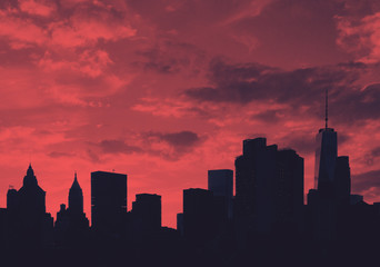 Downtown skyline buildings at sunset in Manhattan, New York City in red