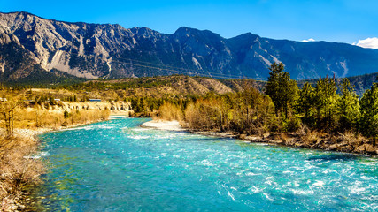 The clear turquoise waters of the Cayoosh Creek just before it runs into the Fraser River at the town of Lillooet in British Columbia, Canada