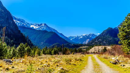 Naklejka premium Dirt road in the Coast Mountains at the Duffey Lake Road near the town of Lillooet in British Columbia, Canada
