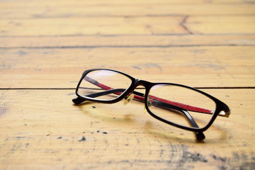 Glasses on dark wood desk.