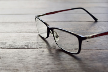 Glasses on dark wood desk.