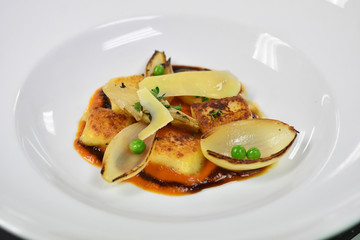 close up of a main dish with chicken, onions and cheese