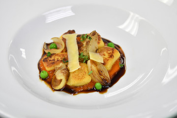 close up of a main dish with chicken, onions and cheese