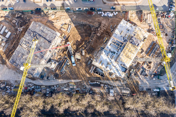 aerial image of urban construction site with tower cranes