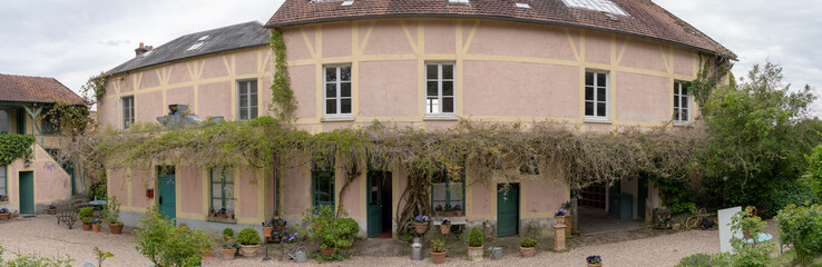 Giverny, France - 05 07 2019: The gardens of Claude Monet in Giverny. The Hotel Baudy