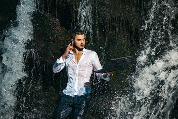 Waterproof technology. Work in nature concept. Man with notebook stand near waterfall. Modern technology. Successful businessman follow flow. Guy formal style hold laptop. Wireless technology