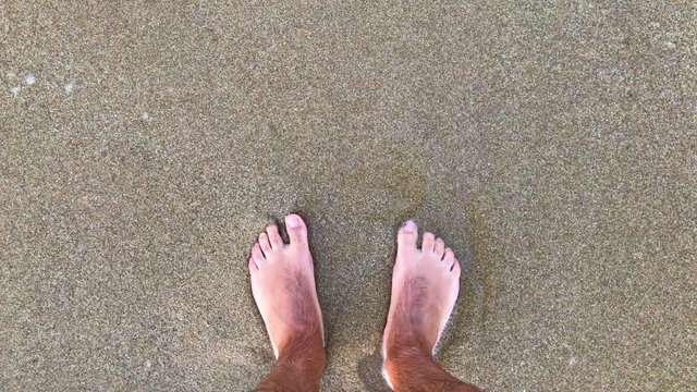 Foots on Beach Sand