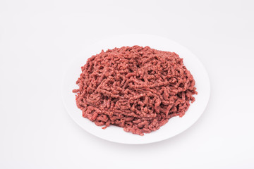 Food, national cuisine and delicious concept - isolated raw minced beef