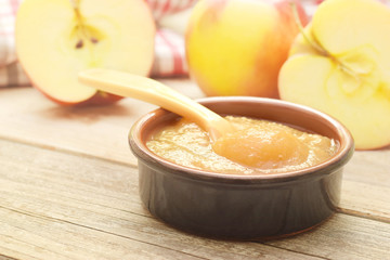 Apple puree in bowl with beby spoon