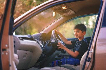 Cute Indian child in car