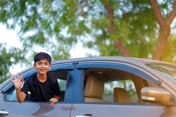 Cute Indian child in car