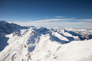 Fototapeta na wymiar High in the mountains, snow-capped peaks