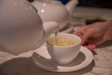 Closeup on Step of Chinese Pour tea with concept of care and healthy