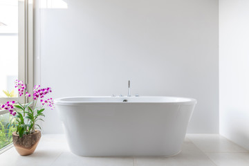 Luxury bathroom features bathtub with flower