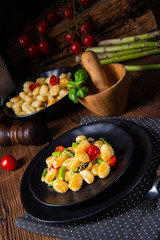 crispy gnocchi with roasted asparagus and tomatoes