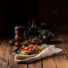 tender beef topped with various vegetables