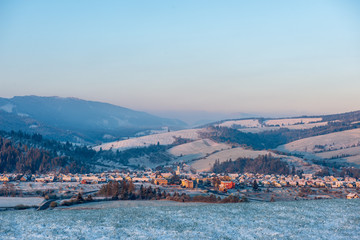 fields and forests covered in snow in winter frost
