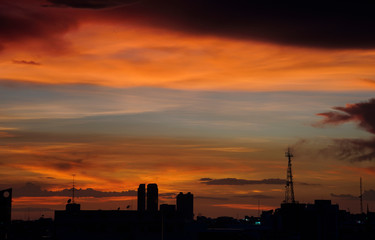 Rainbow color of twilight sky cloud in a evening over Bangkok city, Thailand