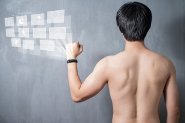A Sport man is using smart band with virtual screen device