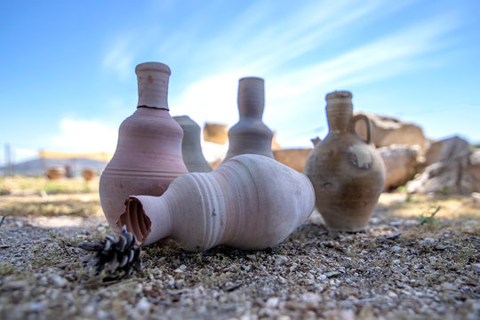 Ancient amphoras against the backdrop of the ruins of the historic city of Zipory, National Park, Israel. Tourism and travel