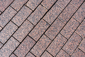 Granite tiles lie diagonally. View from above. Texture.