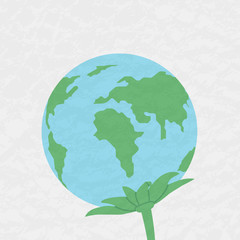 Fototapeta premium Planet Earth with leaves. Plant. The concept of environmental protection.
