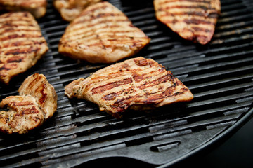 Grilled turkey meat. Steak turkey grill on on huge gas grill . Picnic. Summer. Top view. Flat lay. Copy space.
