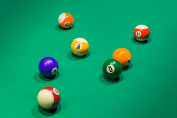 Billiard balls on pool green table