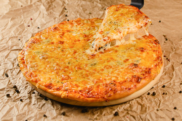 Hot pizza on craft paper background