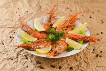 fried shrimps with lemon on plate