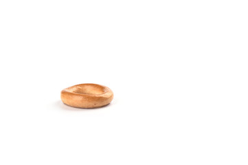 One crispy bagel isolated on white background.