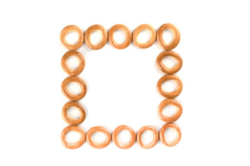 Top view. Several crispy bagels isolated on white background.