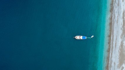  Aerial view of beautiful natural background at the summer time. Aerial view of tropical island beach holiday yacht on blue reef ocean. Holiday icons