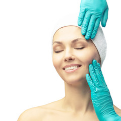 Female derma rejuvenate treatment. Doctor in gloves touch woman face. Cosmetology pretty portrait....