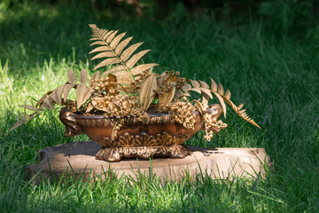 vase with golden decorative leaves