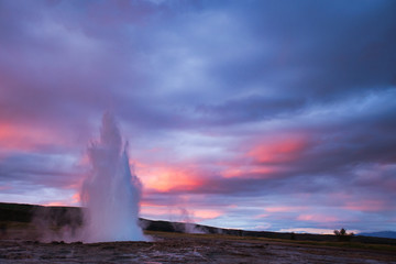 Strokkur Geysir Eruption with Dark Cloudy Sky, Iceland