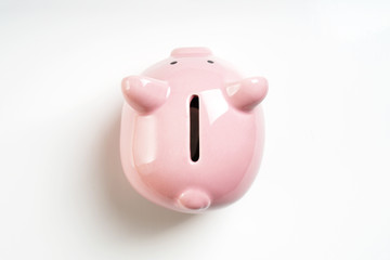 overhead view piggy or coin bank or piggybank or money box - finance and savings concept on white...