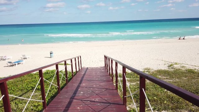 Varadero Cuba the perfect beach blue waters and a wooden bridge in Varadero on their way to a white tropical beach and turquoise ocean