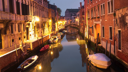 Obraz na płótnie Canvas Venice, Italy. Boats in canal at night city. Venezia cityscape. Old street in Venice island with illumination