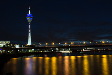 Fototapeta na wymiar View of the center of Dusseldorf, river Rhine and the TV tower in night, Germany